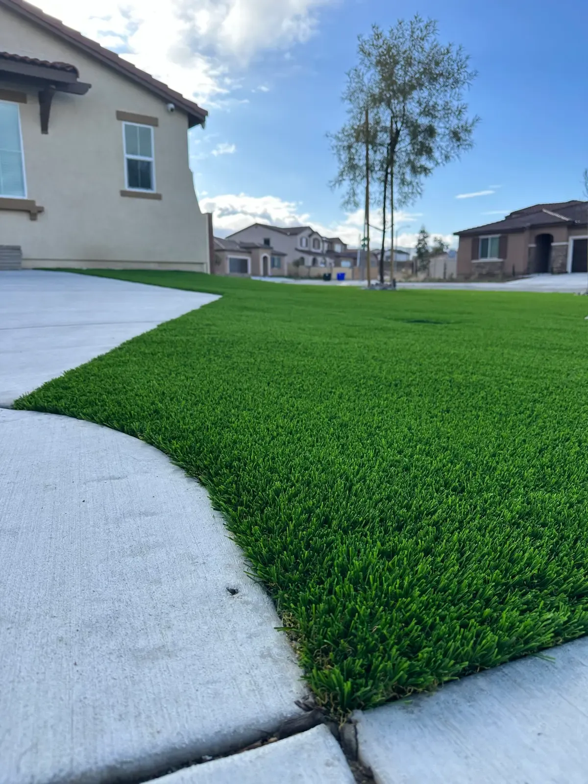 Artificial grass installed around pool deck area