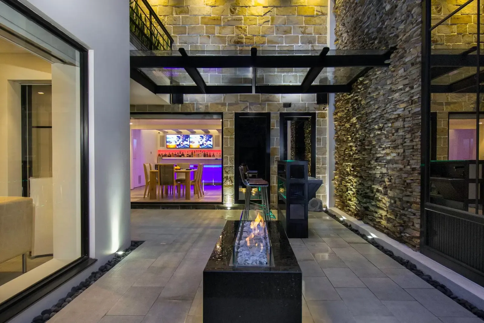 Custom outdoor living space by Quality First Turf